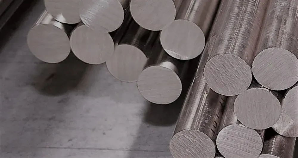 Stack of round metal bars seen from their cut ends