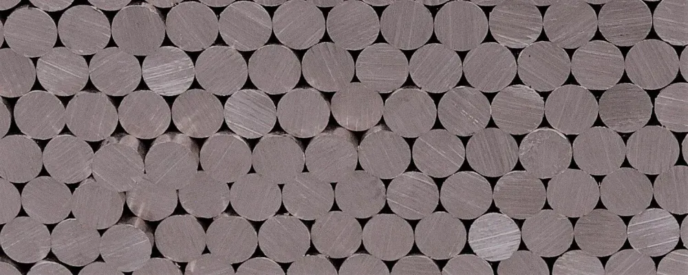 Stack of round metal bars seen from their cut ends