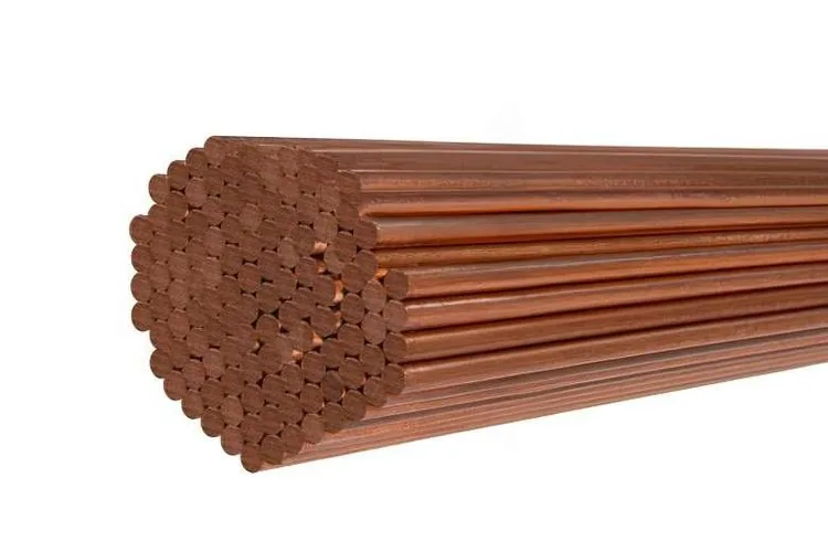 A bundle of copper alloy bars, seen end-on.