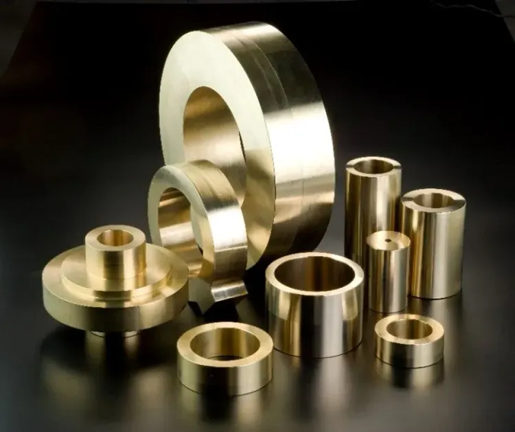 Machined Si45Z rings, bushings and flanged sleeves on a dark background